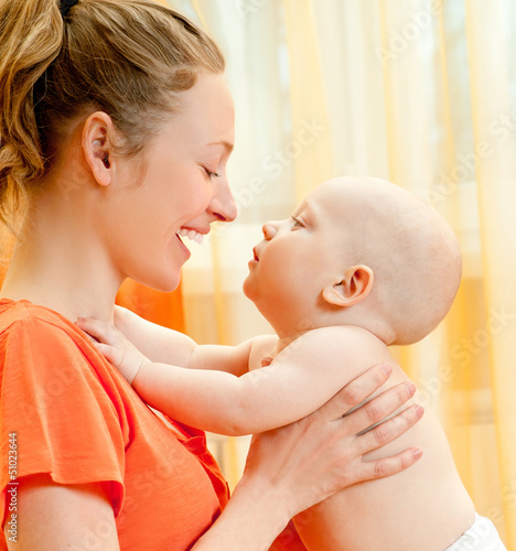 Photo: Mother and son play in the bedroom Mother and son play in the bedroom