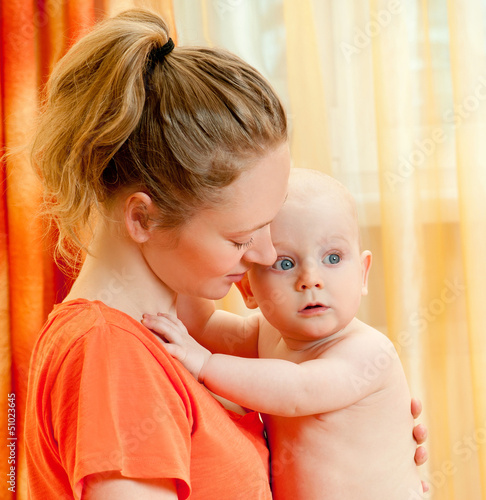 Photo: Mother and son play in the bedroom Mother and son play in the bedroom