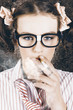 Edgy grunge portrait of a smoking hipster nerd