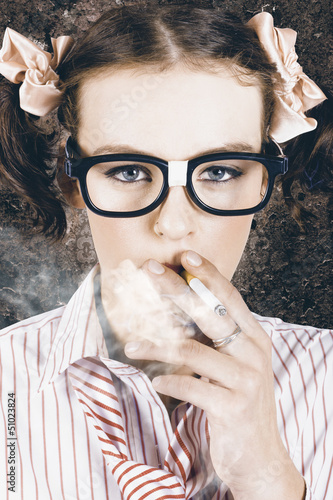 Photo: Edgy grunge portrait of a smoking hipster nerd Edgy grunge portrait of a smoking hipster nerd