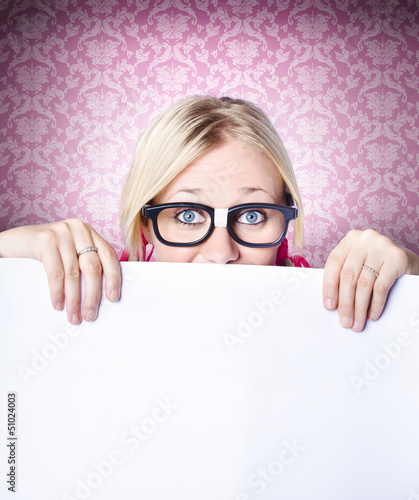 Photo: Funny female worker holding blank banner board Funny female worker holding blank banner board