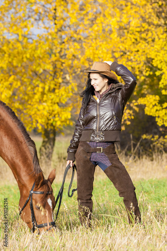 Photo: equestrian with her horse in autumnal nature equestrian with her horse in autumnal nature