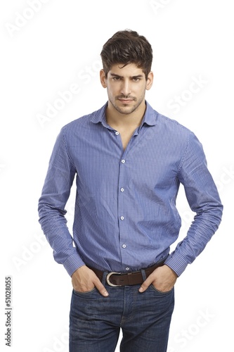 Photo: Confident young man in jeans and shirt Confident young man in jeans and shirt