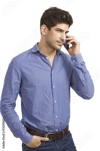 Photo: Young man on phone call Young man on phone call