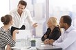 Young businessman presenting to partners