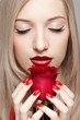 blonde woman with rose