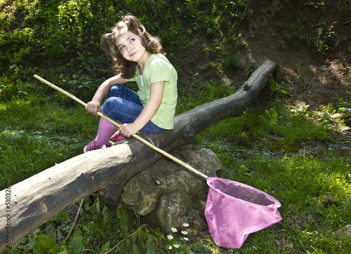 Photo: Cute toddler holding a butterfly net Cute toddler holding a butterfly net