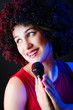 Female performer at disco with mic