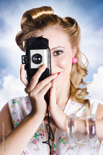 Photo: Vintage film photographer taking outdoor portrait Vintage film photographer taking outdoor portrait