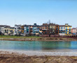 Parma river with houses and bridge in winter day