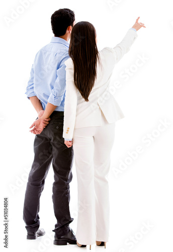 Photo: Business people pointing away Business people pointing away