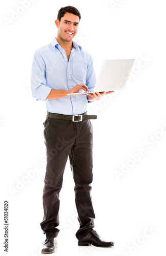 Photo: Business man holding a laptop Business man holding a laptop