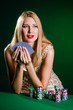 Woman in casino playing cards