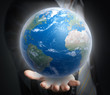 Photo: World in a hand close up World in a hand close up