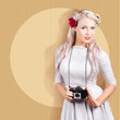 Creative vintage woman holding retro camera