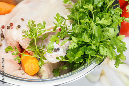 Photo: Chicken and vegetables in pot, close up Chicken and vegetables in pot, close up