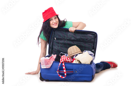 Photo: Young girl packing for vacation Young girl packing for vacation