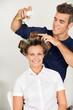 Customer With Hairstylist Setting Curls With Hairspray