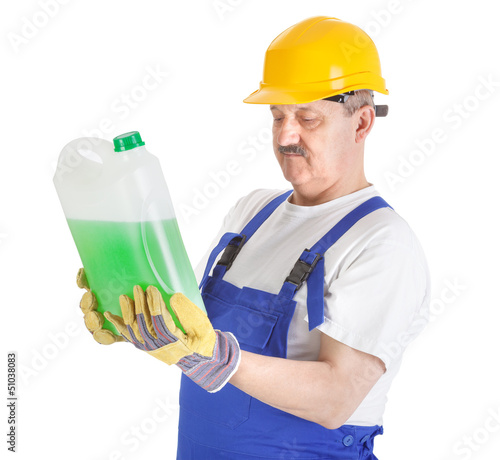 Photo: manual worker with green liquid over white manual worker with green liquid over white