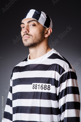 Photo: Convict criminal in striped uniform Convict criminal in striped uniform