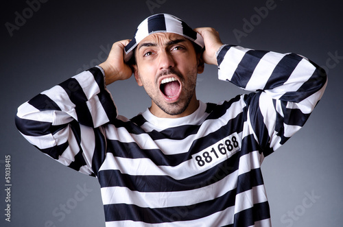 Photo: Convict criminal in striped uniform Convict criminal in striped uniform