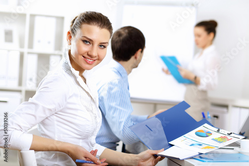 Photo: Young business people working together Young business people working together