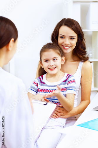 Photo: Little girl and a doctor Little girl and a doctor