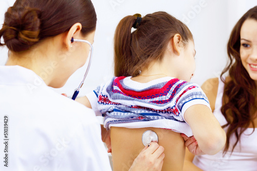 Photo: Little girl and a doctor Little girl and a doctor