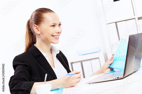 Photo: Business woman in office Business woman in office