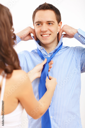 Photo: Businessman dressing at home in the morning Businessman dressing at home in the morning