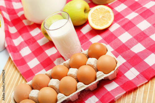 Photo: Milk in a glass jar and eggs Milk in a glass jar and eggs