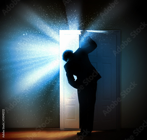 Photo: Young businessman opening door Young businessman opening door