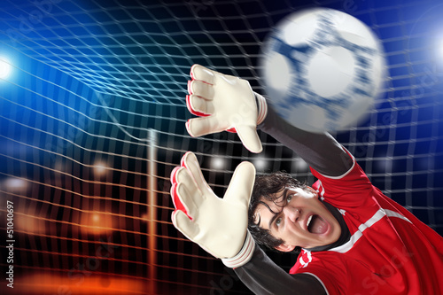 Photo: Goalkeeper catches the ball Goalkeeper catches the ball