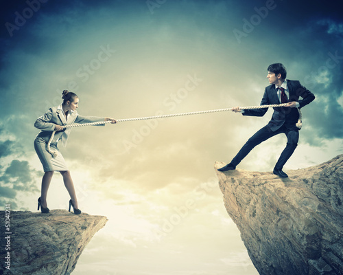 Photo: People pull the rope. People pull the rope.