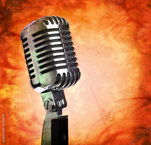 Photo: Vintage microphone on grunge background Vintage microphone on grunge background