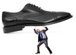 Woman domination concept with shoes and man