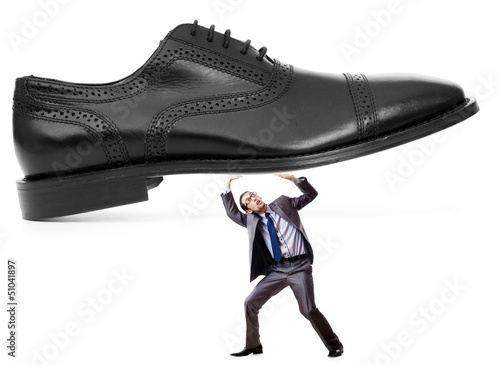 Photo: Woman domination concept with shoes and man Woman domination concept with shoes and man