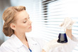 lab worker holding up test tube