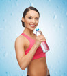 sporty woman drinking water from bottle