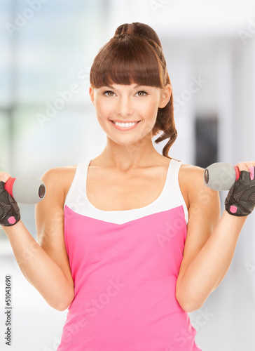 Photo: fitness instructor with dumbbells fitness instructor with dumbbells