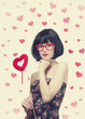 Beautiful girl with toy heart.