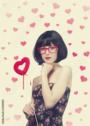 Photo: Beautiful girl with toy heart. Beautiful girl with toy heart.