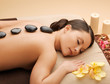 beautiful woman with hot stones
