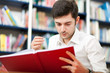 Young student studying in a library