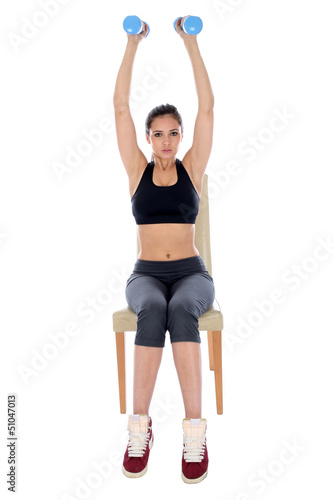 Photo: Young Woman Exercising Young Woman Exercising