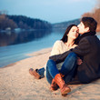 Young attractive couple in love posing in cold spring