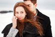 Outdoor happy couple in love posing in cold winter weather