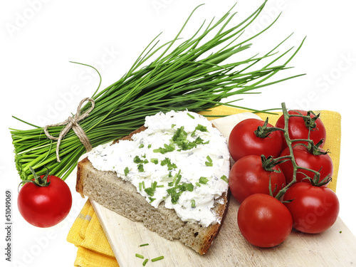 Photo: a slice of bread with cheese and chives - healthy food a slice of bread with cheese and chives - healthy food