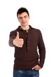 Photo: Young man showing thumbs up sign Young man showing thumbs up sign