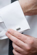 Cuff link, man is getting dressed